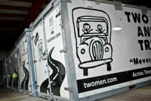 two men and a truck moving containers